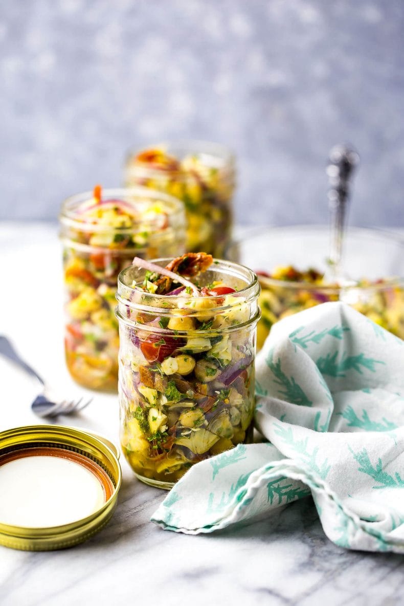 These Mediterranean Chickpea Salad Jars with artichokes and sundried tomatoes are the perfect packable lunch - they're also high protein, vegetarian and gluten-free!