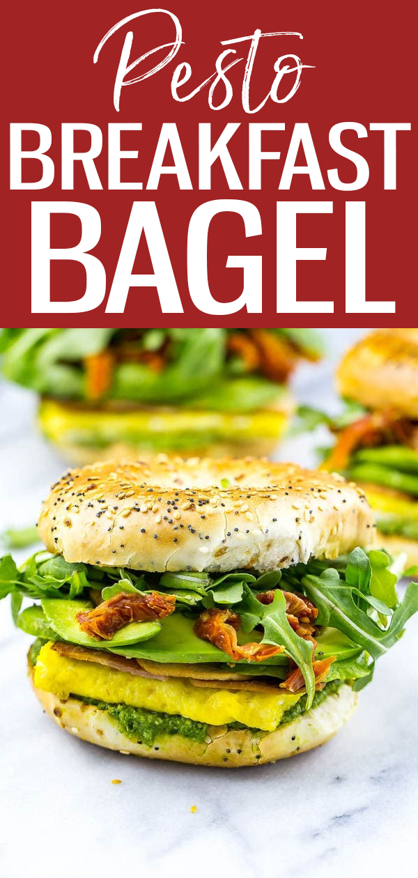 These Pesto Bagel Breakfast Sandwiches are loaded with eggs, bacon, arugula, sundried tomatoes, avocado and pesto in an everything bagel! #breakfastbagel #pestobagel