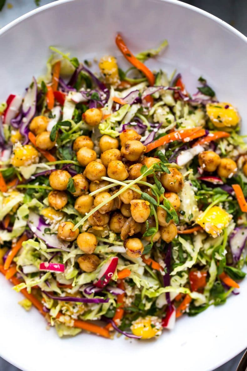 This Chickpea Quinoa Power Salad with Jalapeno Dressing is a delicious, vegetarian rainbow slaw with diced mango and 2-minute chili lime chickpeas!