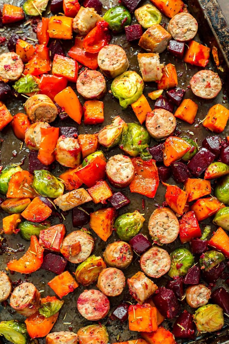 A close-up of sheet pan sausage and vegetables.