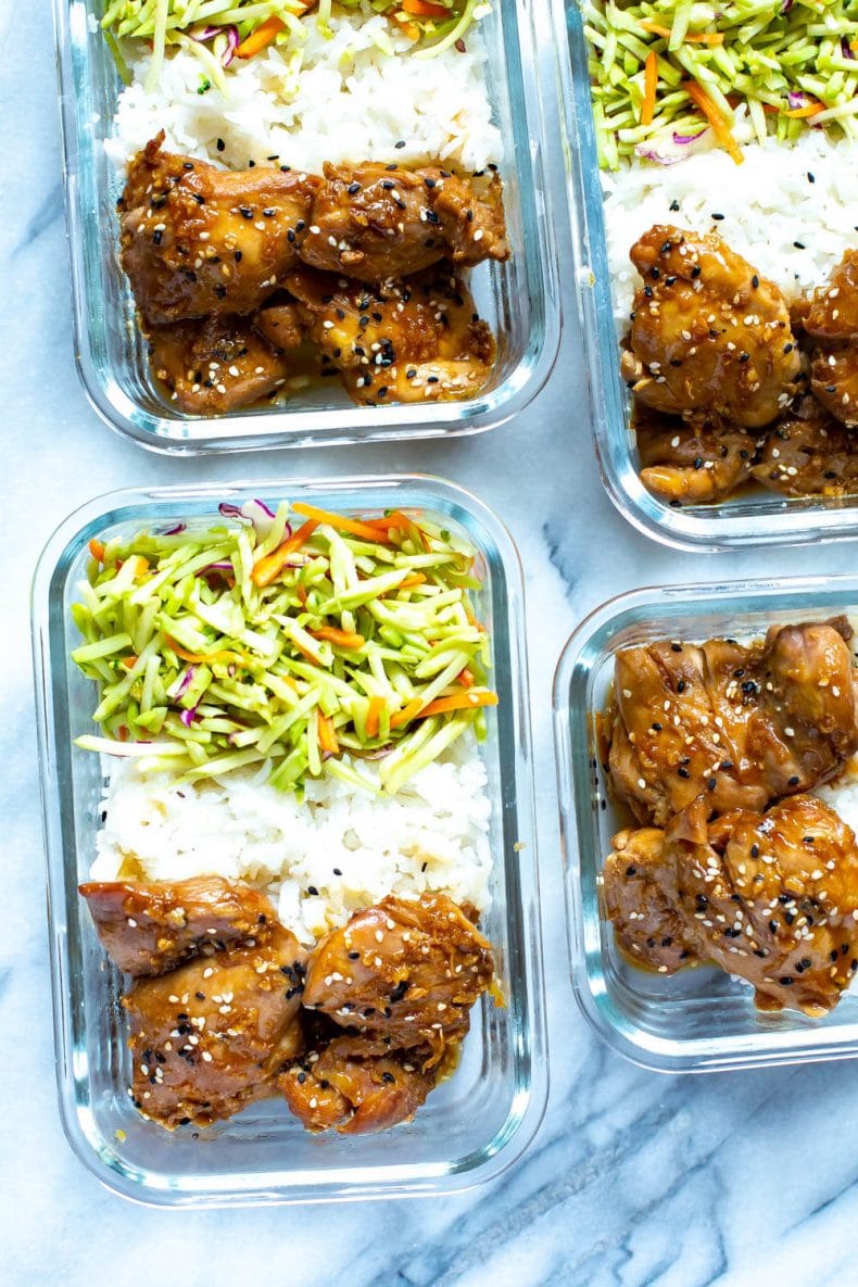 glass meal prep container with Asian sesame chicken dinner