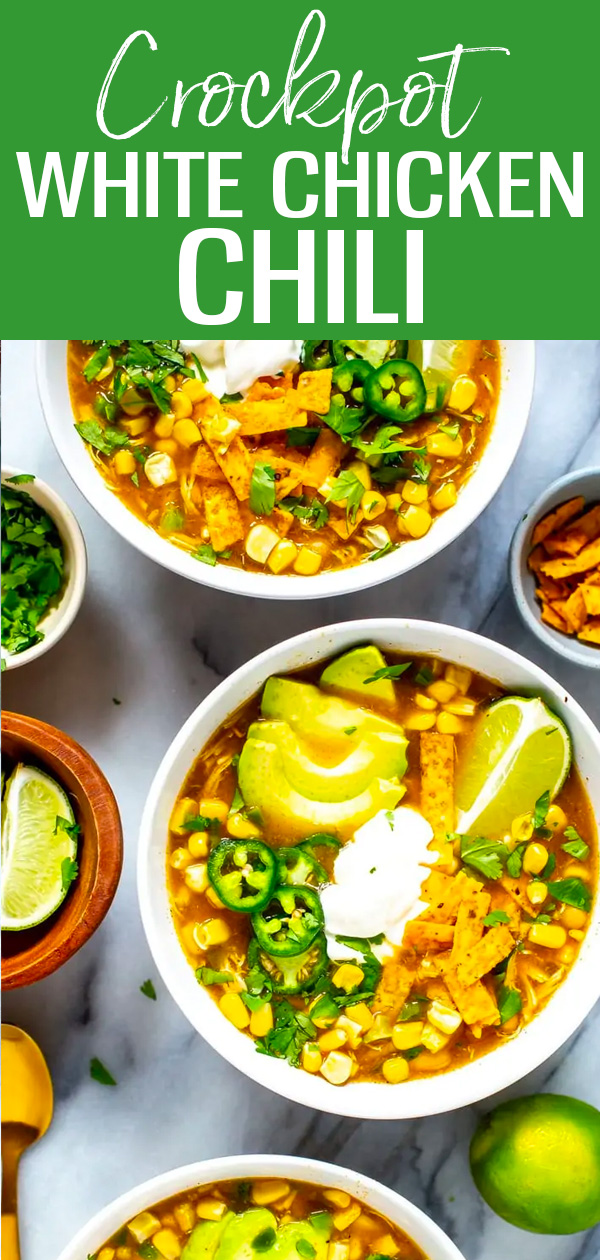 This Crockpot White Chicken Chili is the perfect dump dinner – just add all the ingredients to the slow cooker and serve with fresh toppings! #whitechili #crockpot