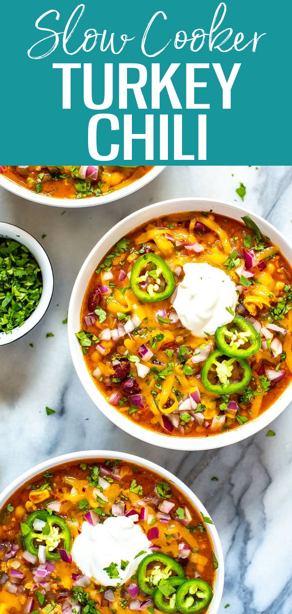 This Healthy Slow Cooker Turkey Chili is the most flavourful chili that’s filled with beans, veggies and turkey, then loaded with toppings. #turkeychili #slowcooker