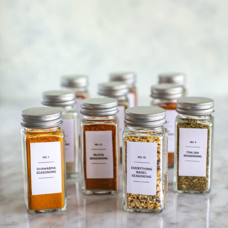 A bunch of homemade spice blends in different jars.