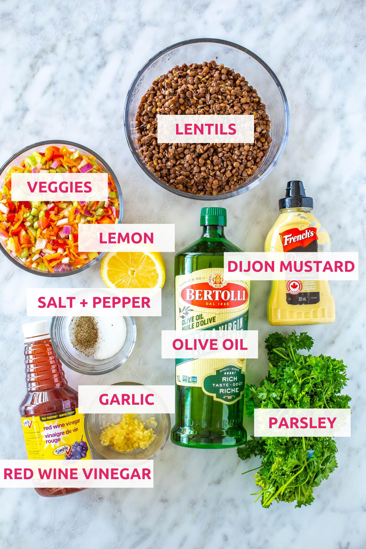 Ingredients for lentil salad: lentils, veggies, lemon, olive oil, dijon mustard, parsley, red wine vinegar, garlic and salt and pepper.