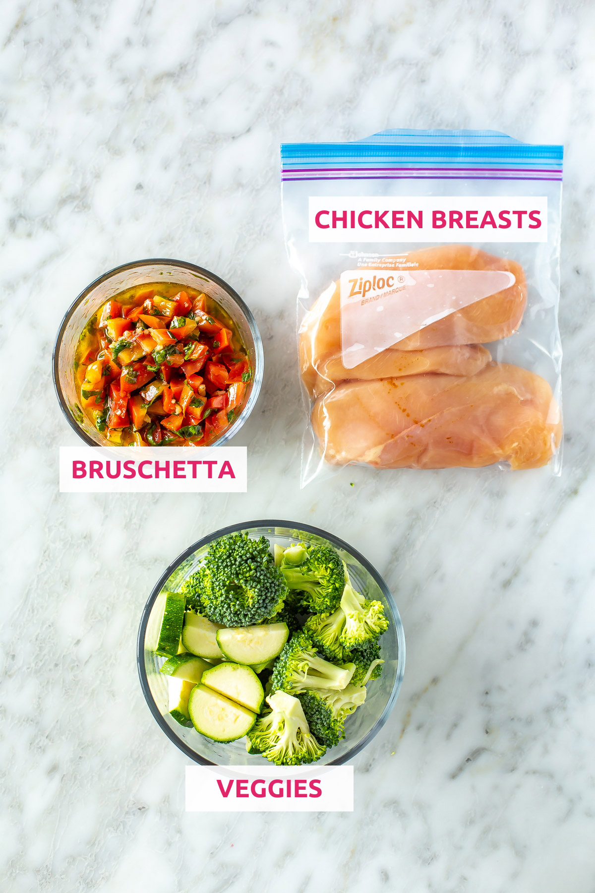 Ingredients for sheet pan bruschetta chicken: chicken breasts, bruschetta, and veggies.