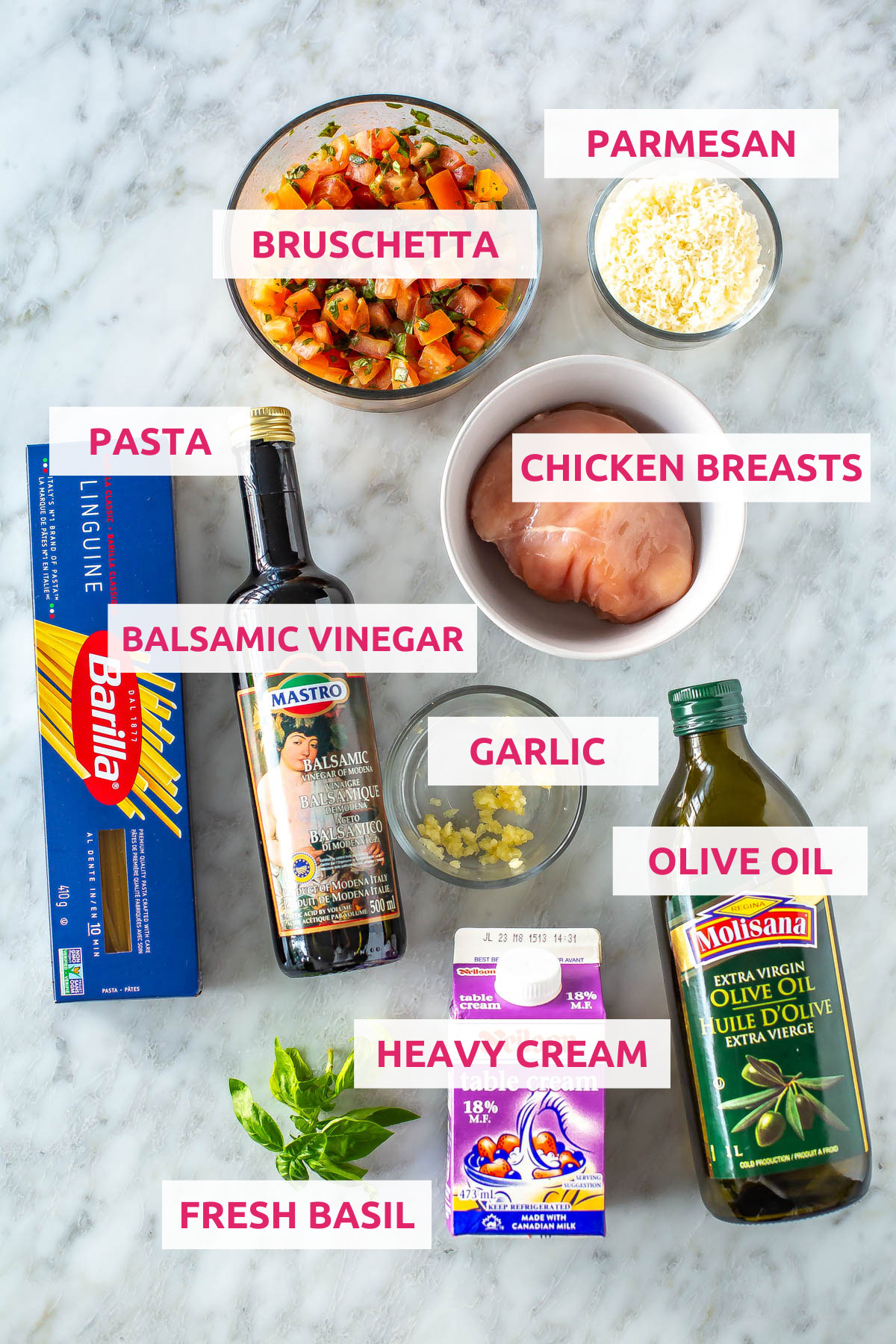 Ingredients for bruschetta chicken pasta: bruschetta, parmesan cheese, pasta, balsamic vinegar, chicken breasts, basil, garlic, heavy cream and olive oil.