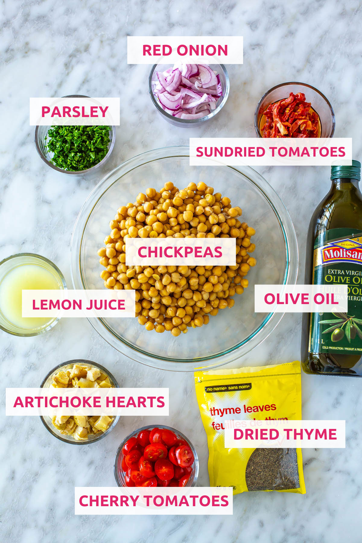 Ingredients for Mediterranean chickpea salad jars: chickpeas, olive oil, red onion, parsley, sundried tomatoes, lemon juice, artichoke hearts, cherry tomatoes and dried thyme.
