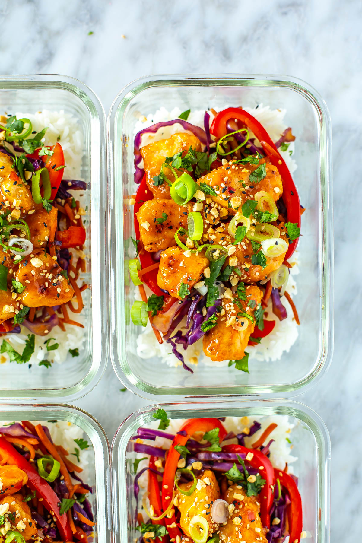 A close-up of a sweet chili chicken meal prep bowl.