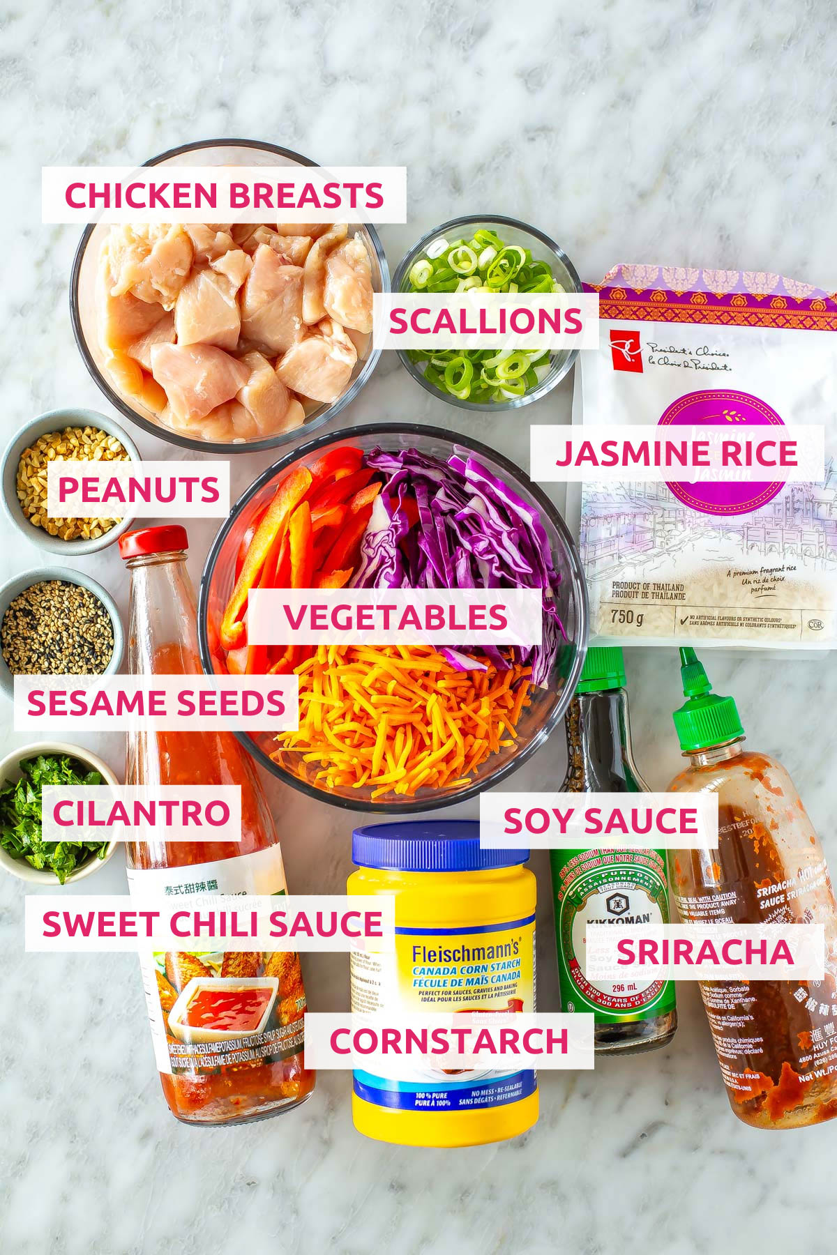 Ingredients for sweet chili chicken: chicken breasts, jasmine rice, peanuts, scallions, vegetables, sesame seeds, cilantro, sweet chili sauce, cornstarch, soy sauce and sriracha.
