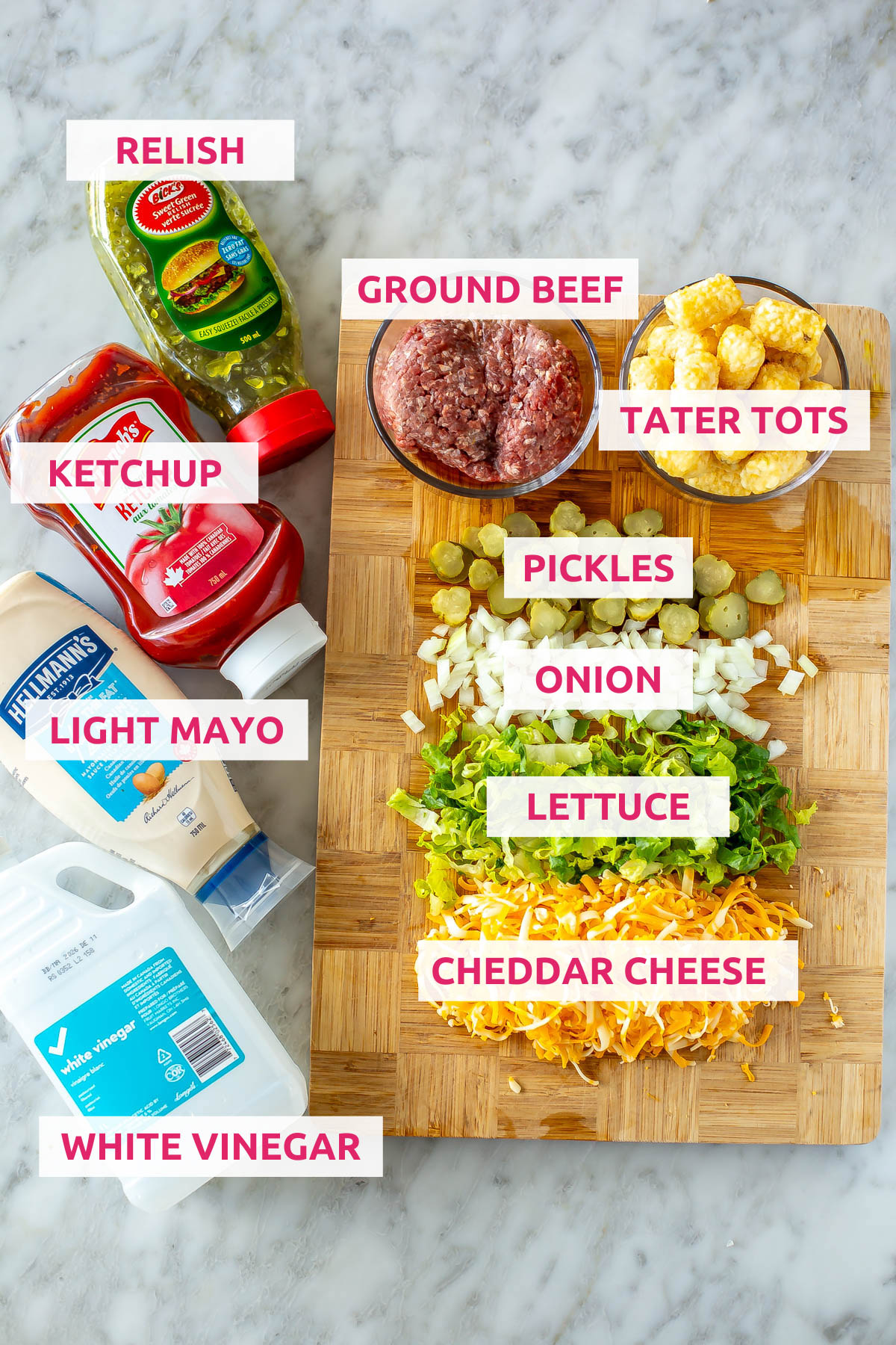 Ingredients for big mac tater tot nachos: ground beef, tater tots, pickles, onion, lettuce, cheddar cheese, white vinegar, light mayo, ketchup and relish.