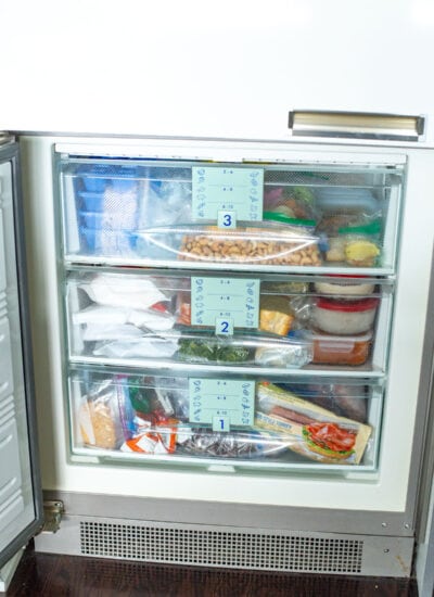 An organized freezer with 3 drawers.
